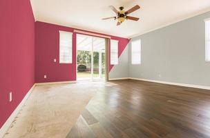 Empty Room with Cross Section Showing Before and After With New Wood Floor and Paint photo