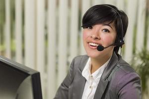 Attractive Young Mixed Race Woman Smiles Wearing Headset photo