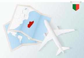 Travel to Madagascar, top view airplane with map and flag of Madagascar. vector