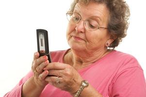 Senior Woman Using Cell Phone photo