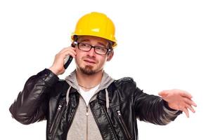 Handsome Young Man in Hard Hat on Phone photo