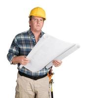 Male Contractor With House Plans Wearing Hard Hat Isolated on White photo