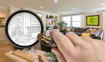 Hand Holding Magnifying Glass Revealing Custom Living Room Design Drawing and Photo Combination