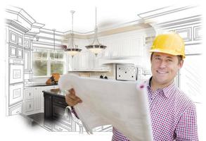 Contractor Holding Blueprints Over Custom Kitchen Drawing and Photo