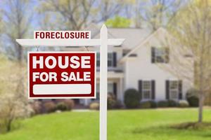 Foreclosure Home For Sale Sign in Front of House photo