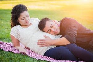 Hispanic Pregnant Young Couple Portrait Outdoors photo