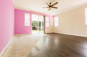 Empty Room with Cross Section Showing Before and After With New Wood Floor and Paint photo