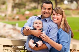 Happy Mixed Race Family Posing for A Portrait photo