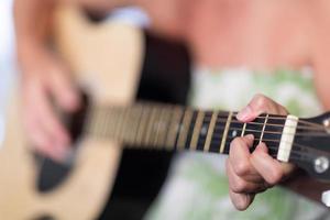 Woman Playing Acoustic Guitar Abstract. photo