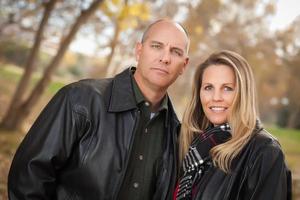 Attractive Couple in Park with Leather Jackets photo