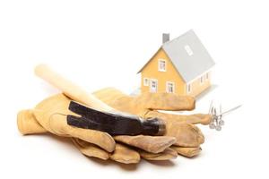 Hammer, Gloves, Nails and House photo