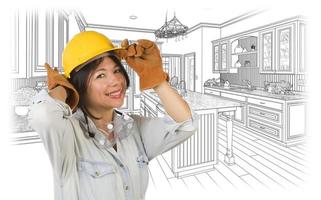 Hispanic Woman in Hard Hat with Kitchen Drawing Behind photo