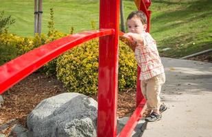 Young Chinese and Caucasian Boy Having Fun at the Park. photo