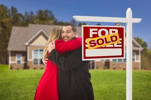 Mixed Race Couple, House, Sold Real Estate Sign photo