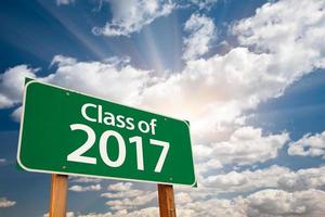 Class of 2017 Green Road Sign with Dramatic Clouds and Sky photo