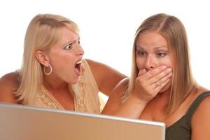 Two Shocked Women Using Laptop photo