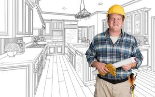 Male Contractor With House Plans Wearing Hard Hat In Front of Custom Kitchen Drawing photo