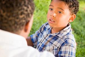 Happy African American Father and Mixed Race Son Playing At The Park photo