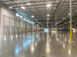 Massive Empty Industrial Warehouse Interior photo