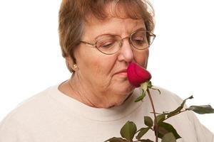 Attractive Senior Woman with Red Rose photo