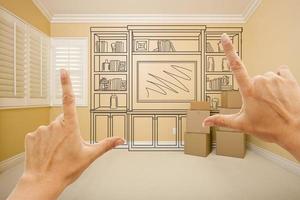 Framing Hands In Empty Room with Shelf Drawing on Wall photo