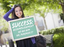 Mixed Race Female Student Holding Chalkboard With Success and Definition photo