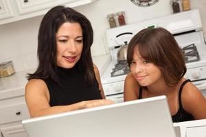 Hispanic Mother and Mixed Race Daughter on the Laptop photo