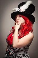 Attractive Red Haired Woman Wearing Bunny Ear Hat photo