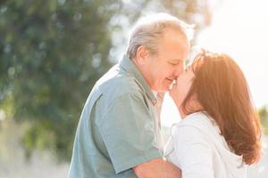 Middle Aged Couple Enjoy A Romantic Slow Dance and Kiss Outside photo