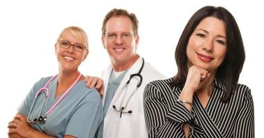 Hispanic Woman with Male Doctor and Nurse photo