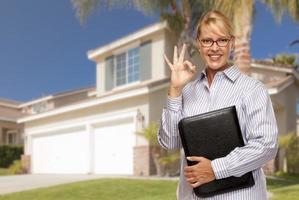 Attractive Businesswoman In Front of Nice Residential Home photo