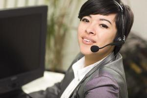 Attractive Young Mixed Race Woman Smiles Wearing Headset photo