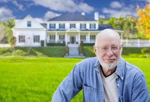 Senior Adult Man in Front of House photo