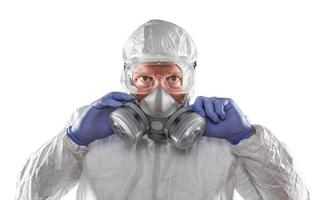 Man Wearing Hazmat Suit, Goggles and Gas Mask Isolated On White photo