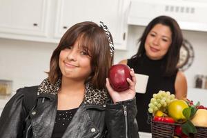 Pretty Hispanic Girl Ready for School with Mom photo