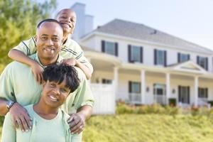 Attractive African American Family in Front of Home photo