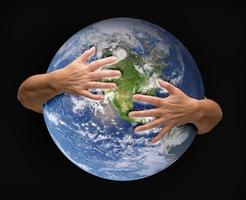 Human Arms Embracing and Nurturing the Planet Earth photo