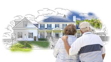 Embracing Senior Couple Over House Drawing and Photo on White