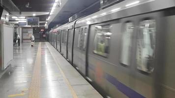 Delhi India -June 21 2022 -Delhi Metro train arriving at Jhandewalan metro station in Delhi, India, Asia, Public Metro departing from Jhandewalan station in which more than 17 lakhs passengers travel video