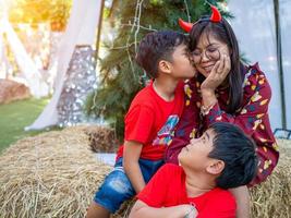 Mother and daughter dressed in red celebrating Christmas. Christmas Festival. photo