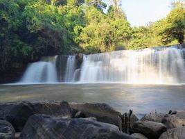 Sri Dit Waterfall is a small and forested one-level waterfall with sunlight at Khao Kho, Phetchabun Province, Thailand. photo