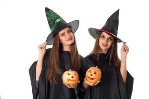 beautiful young girls with pumpkins in hands photo