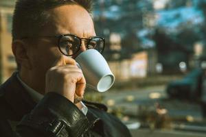 sightly man drinking coffee photo