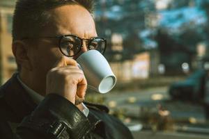 sightly man drinking coffee photo