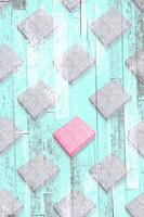 Creative seamless diagonal pattern with one pink gift box among grey ones with turquoise Zine textured overlay. photo