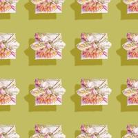 Seamless pattern of gift boxes trendy wrapped in cloth in Furoshiki technique with flowers and shadows on green. photo