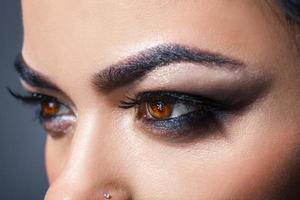 Photo of brown woman eyes looking away