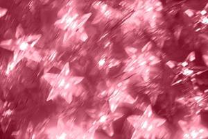 Blurred luminous stars in motion during long exposure lights. Toning in color 2023 Viva Magenta. photo