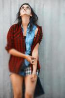 Girl standing with hole with syringe with heroin photo