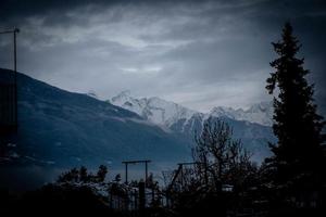 the beautiful mountains of the Aosta valley immersed in the December snow, during the Christmas holidays photo